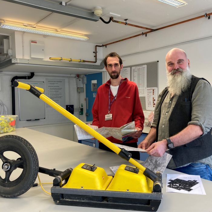 Two academics with Ground Penetrating Radar  