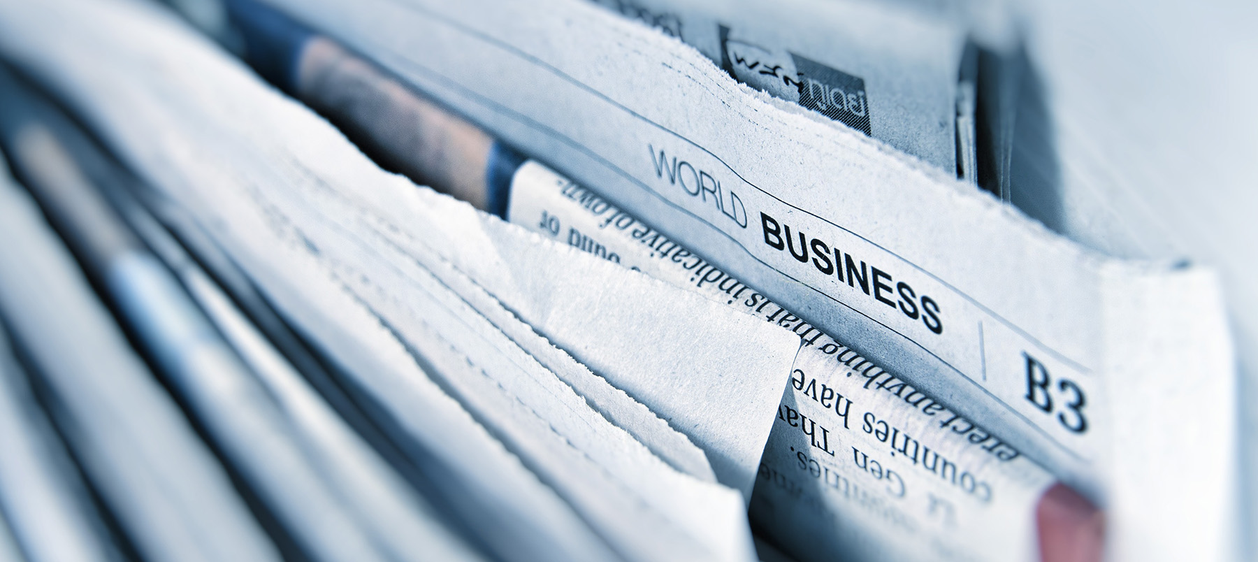 Papers stacked in a filing cabinet drawer