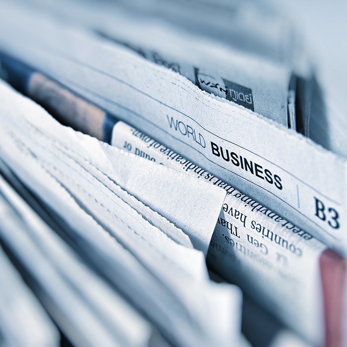 Papers stacked in a filing cabinet drawer