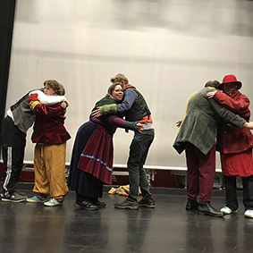 Six Blue Apple theatre actors performing on stage