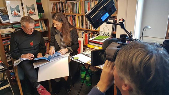Two participants read from text while being filmed