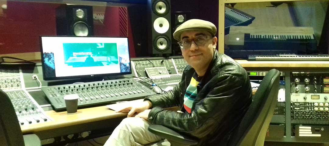  Emre Ramazanoglu smiling, seated at sound desk