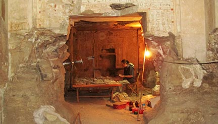 Research image of hole in wall revealing woman alone at small table