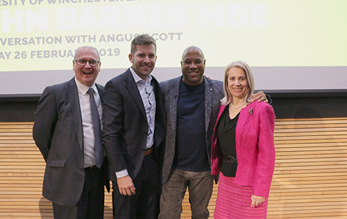 John Barnes with University staff including Vice Chancellor Joy Carter