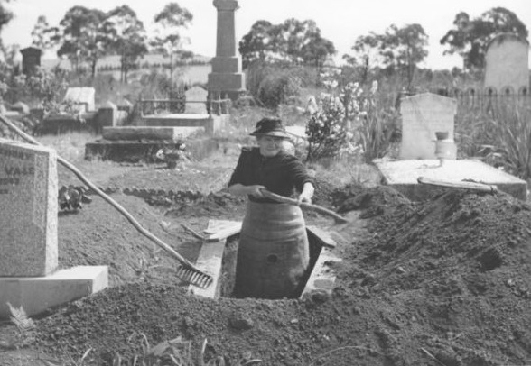 Black and white image of Josephine Smith digging graves
