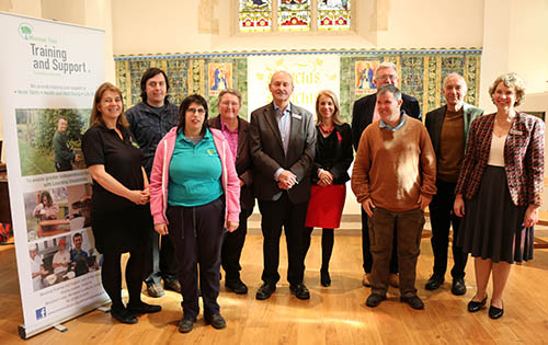 Minstead Trust partnership representatives stand with Vice Chancellor Joy Carter