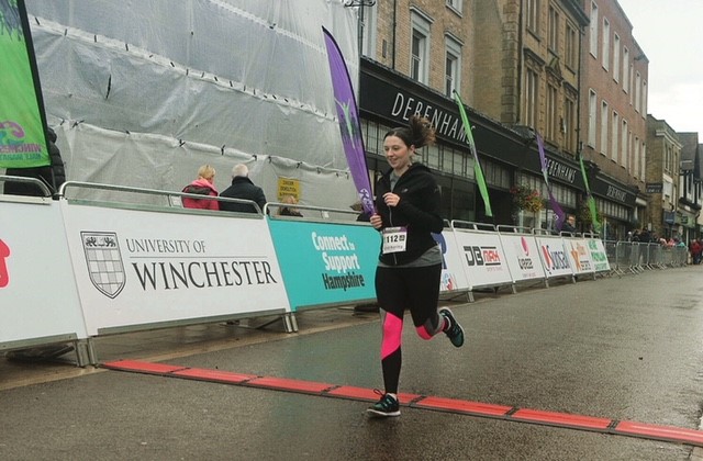 Rachel Hanley crossing the Winchester Half finish line