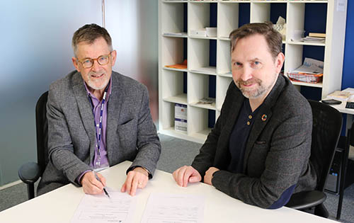 Stephen Boyce and Professor Alec Charles seated at desk