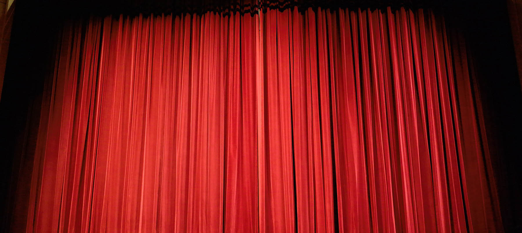 Closed red stage curtains