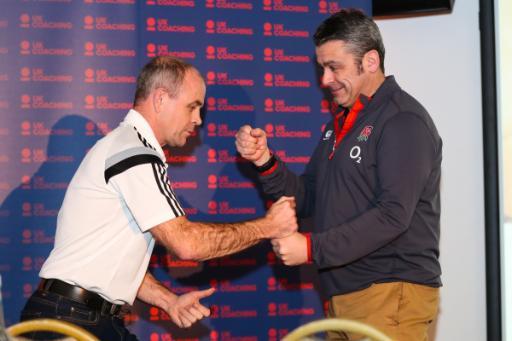 Richard Cheetham fist bumping another man at HRH coaching conference