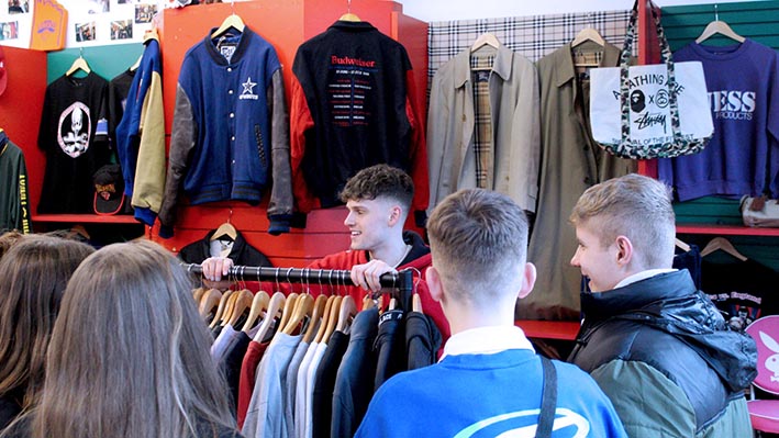 People browsing vintage clothing