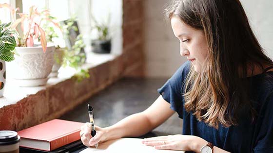 Woman writing in diary