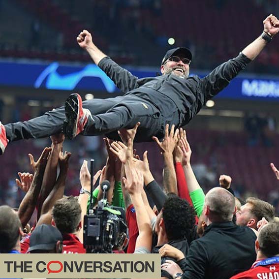 Jürgen Klopp, Manager of Liverpool Football Club, crowd-surfs raised up by team