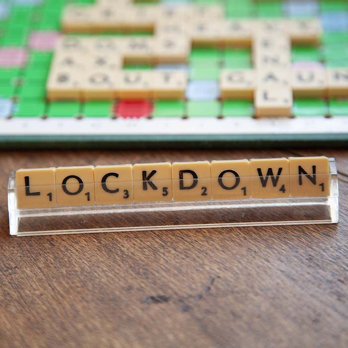 Strip of Scrabble letters that spell 'lockdown'