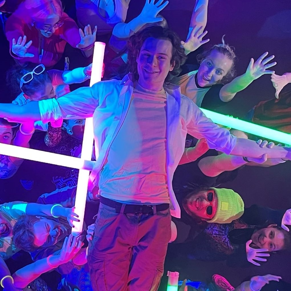 Young man crowdsurfing