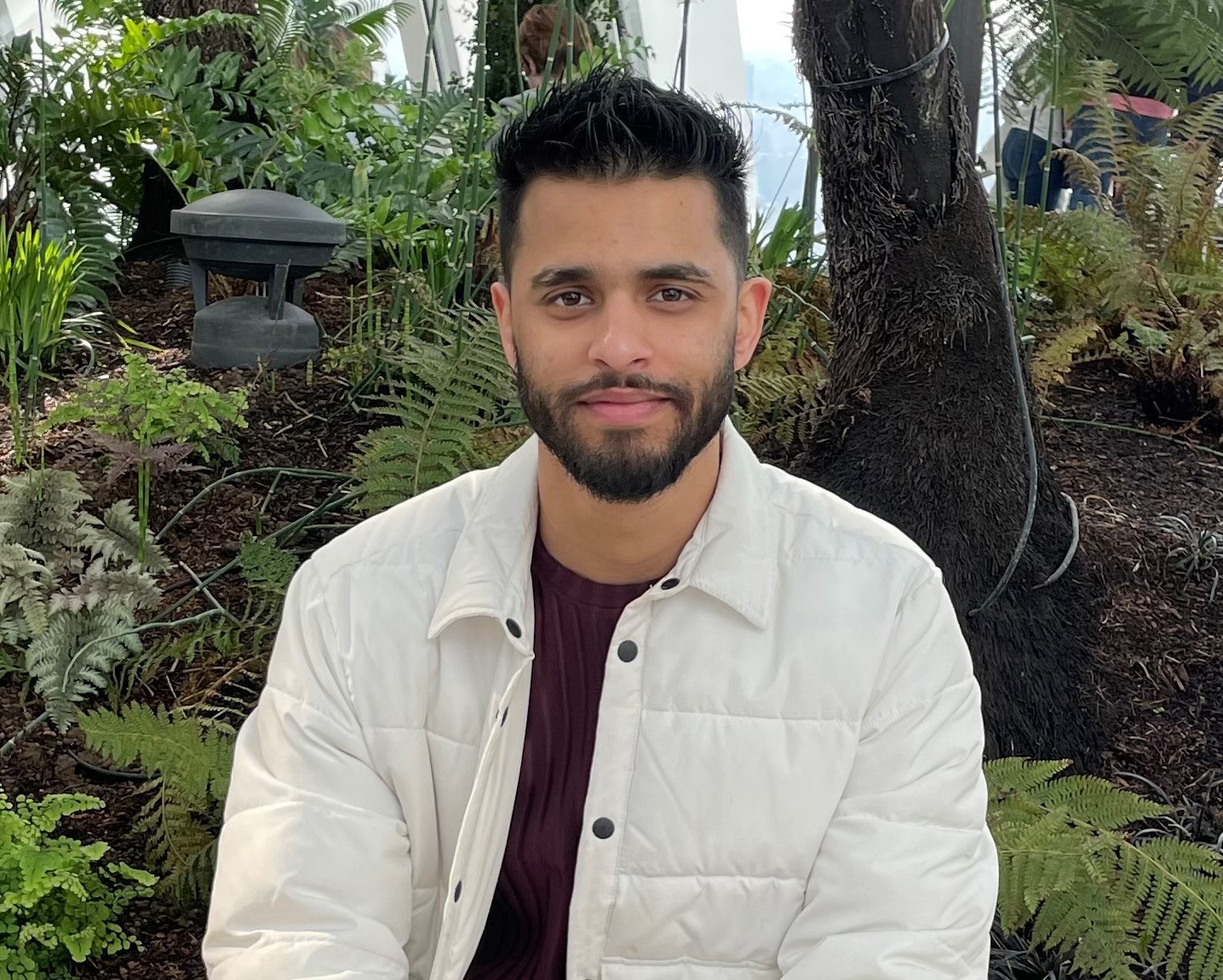 Young man with dark hair and beard