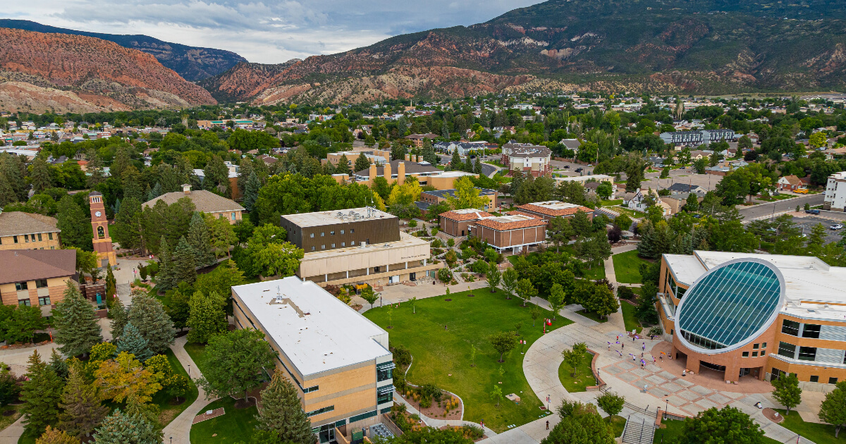 Looking down on university campus set among hills and desert