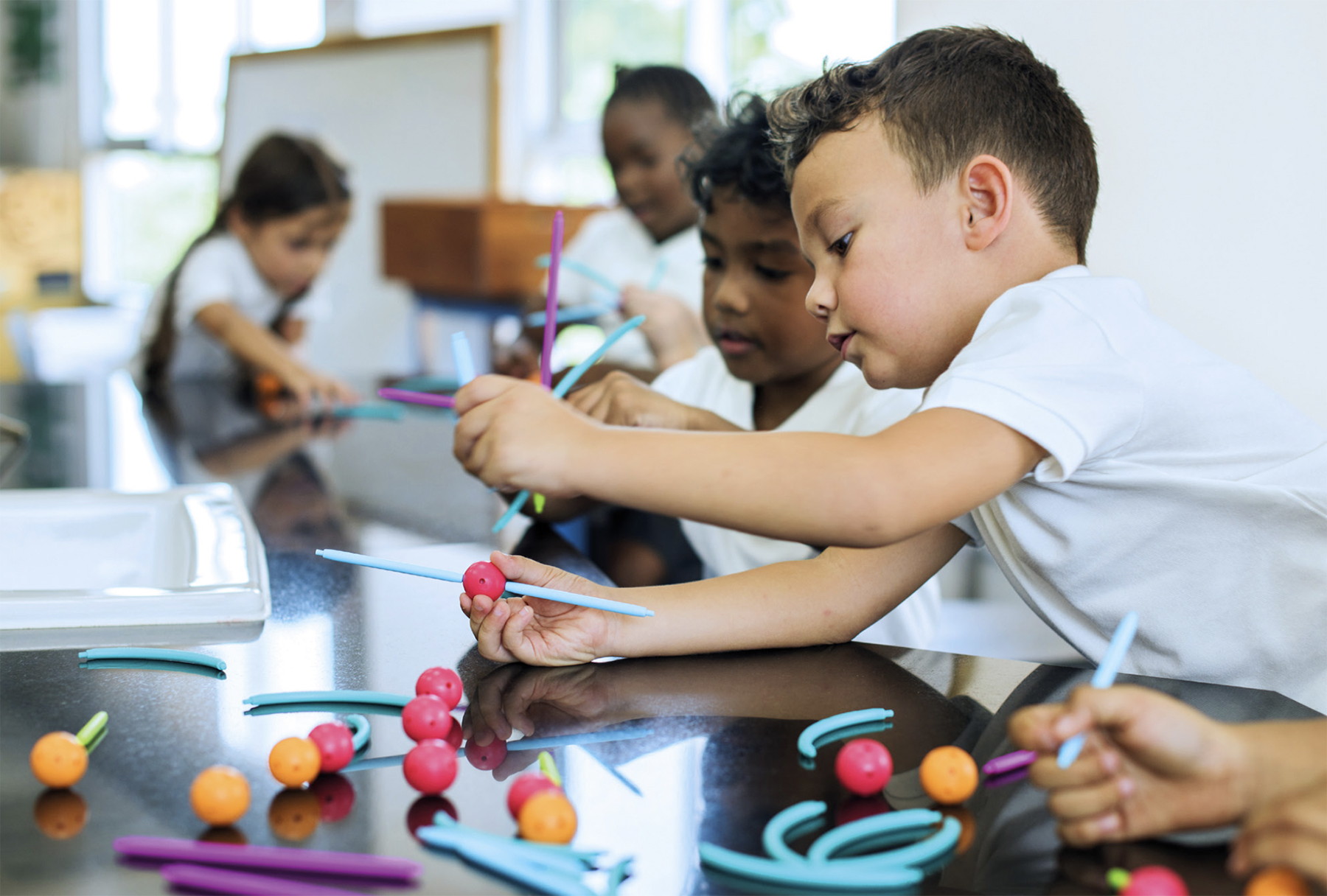 children learning through creative play in a primary school