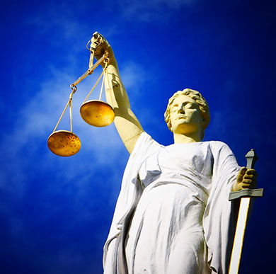 Crime and Justice Research at Winchester: statue of Lady Justice holding scales and sword