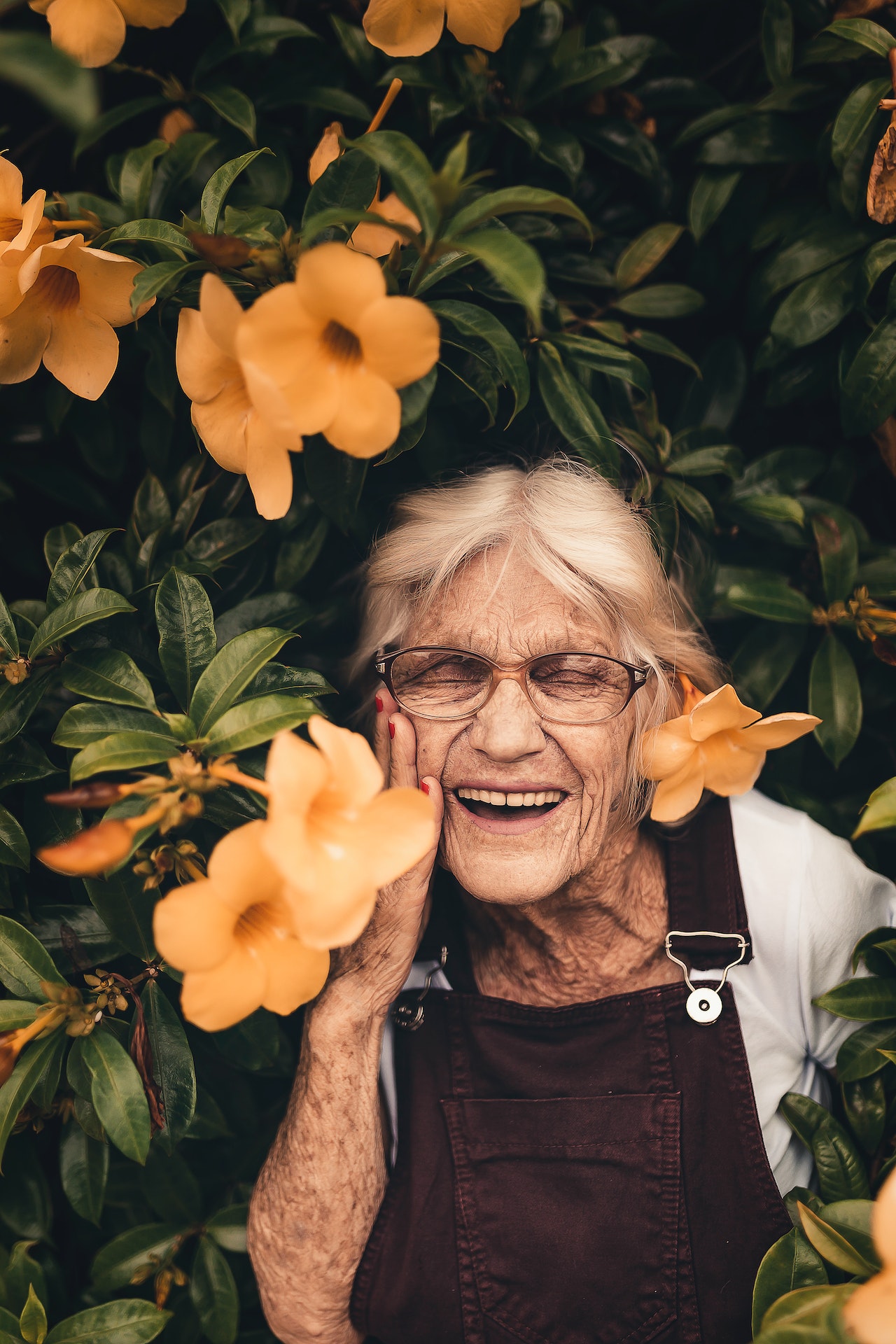 Old lady surrounded by flowers 