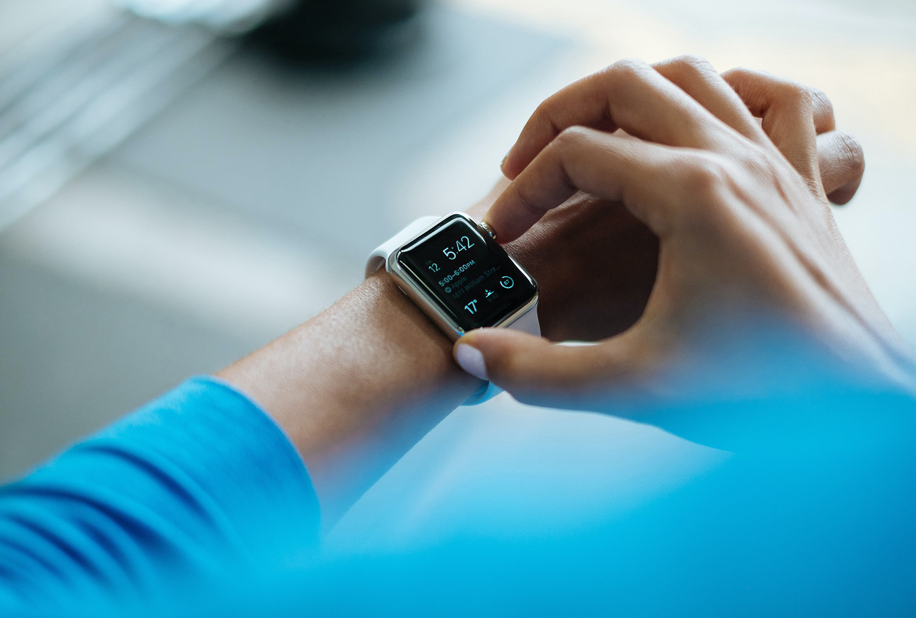 Fitness person using their smart watch to track their fitness