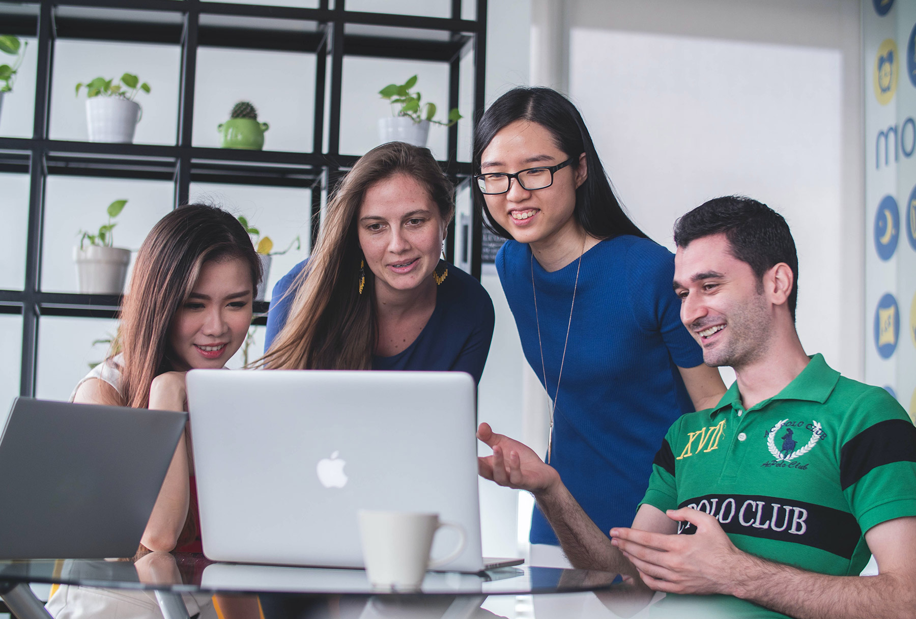 Group of people looking at a computer