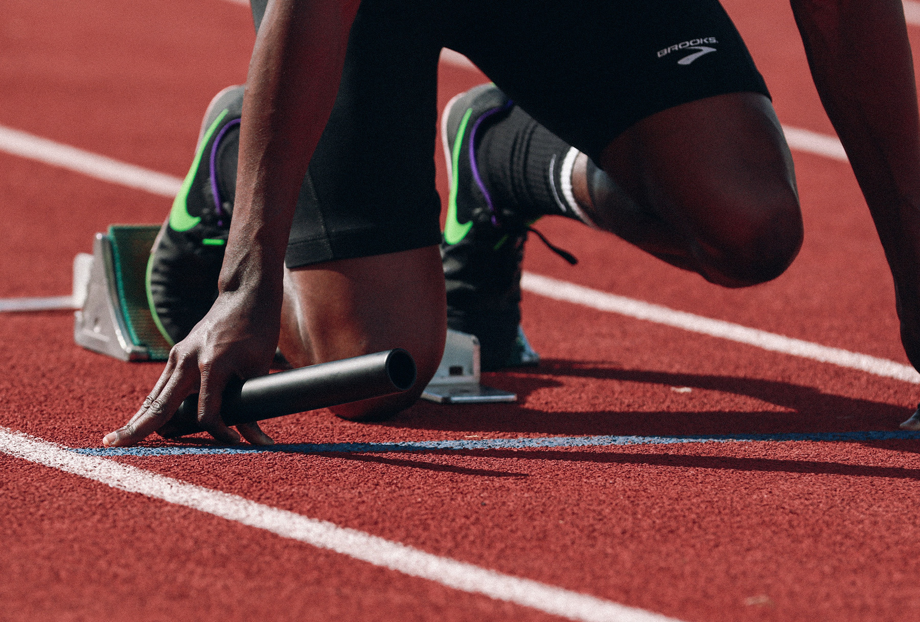 Person on a track preparing to run