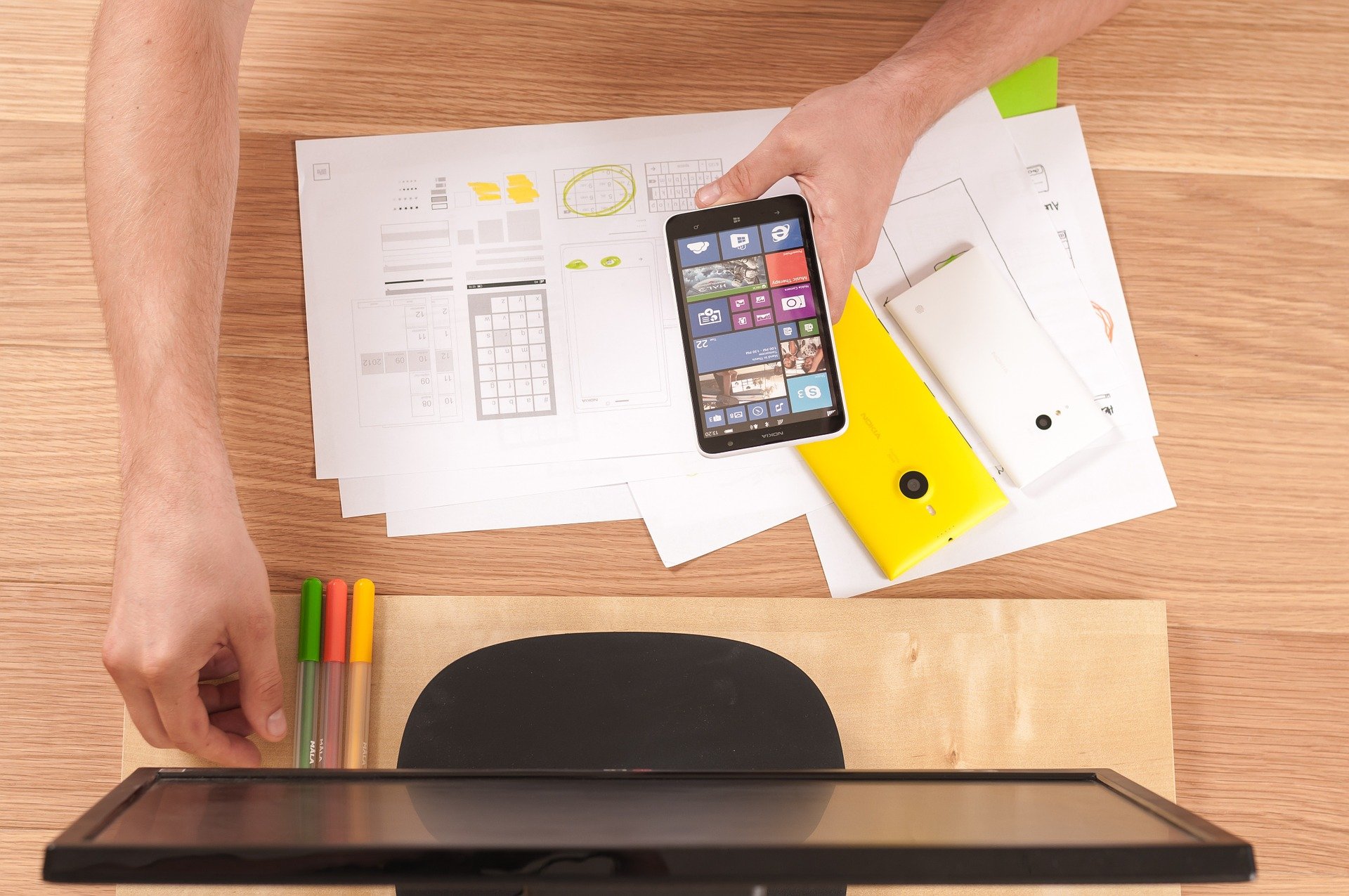 Student studying with notes and phone