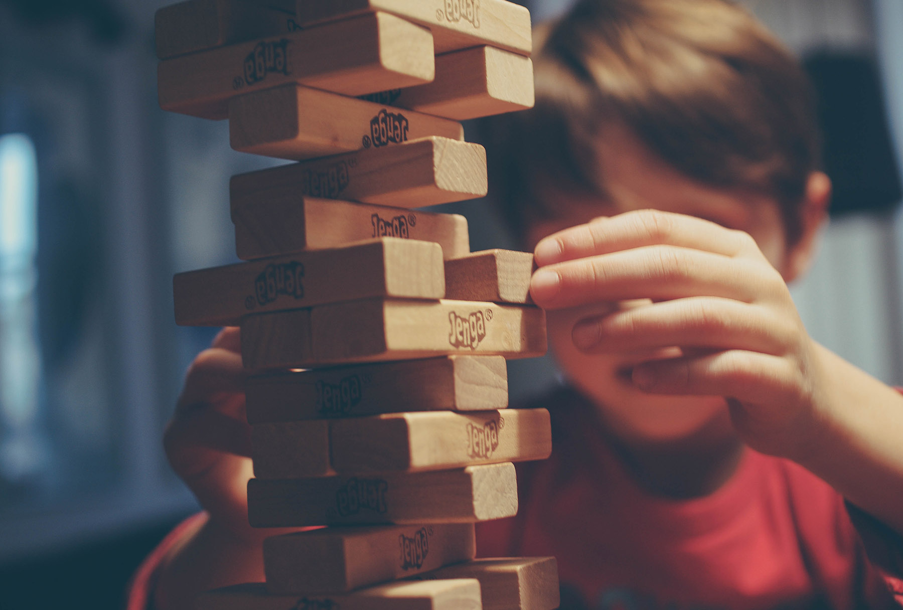 Child playing 'jenga' game