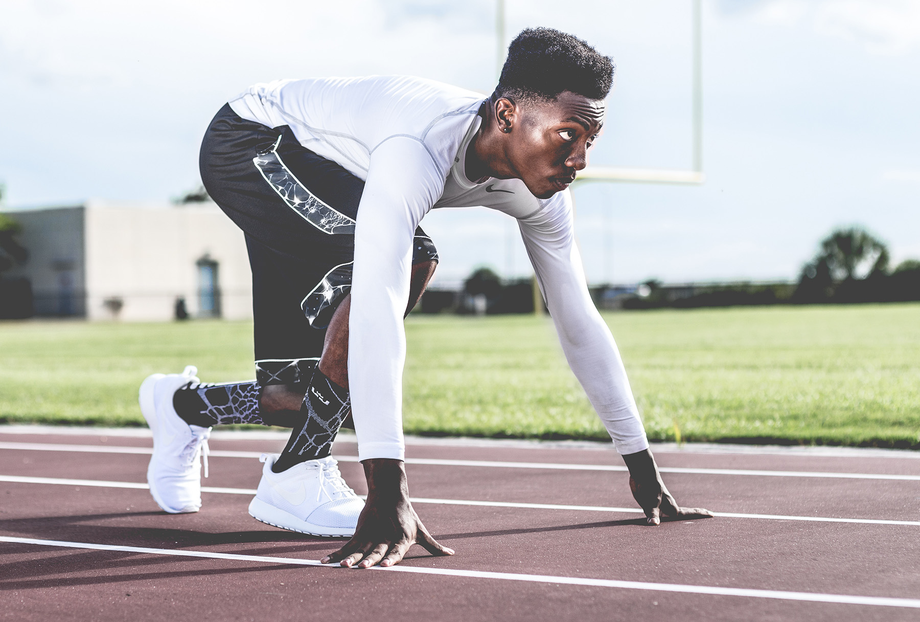 A man in the start position to begin a race