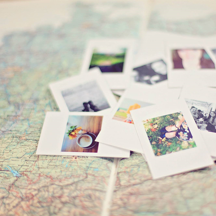 Polaroid pictures on a map