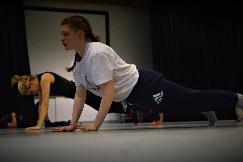 Group of students dancing in a performance studio