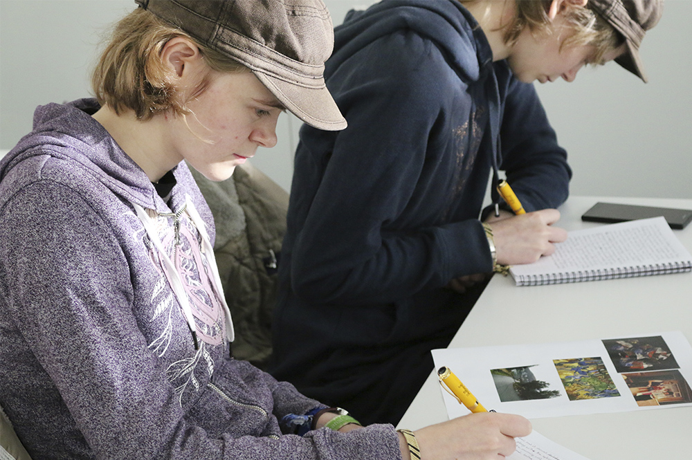 Students writing in a lecture