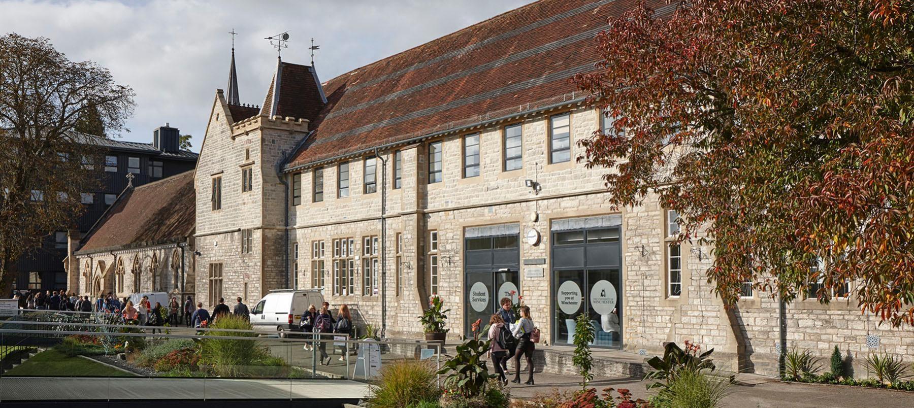 winton building exterior with students on campus