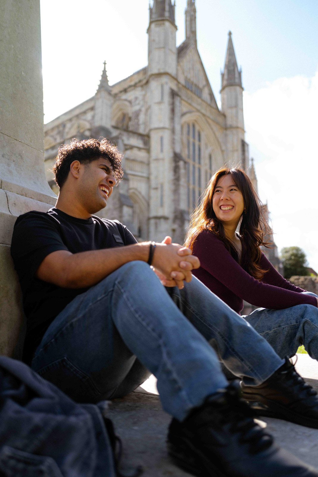 Students sat outside Winchester Cathedral
