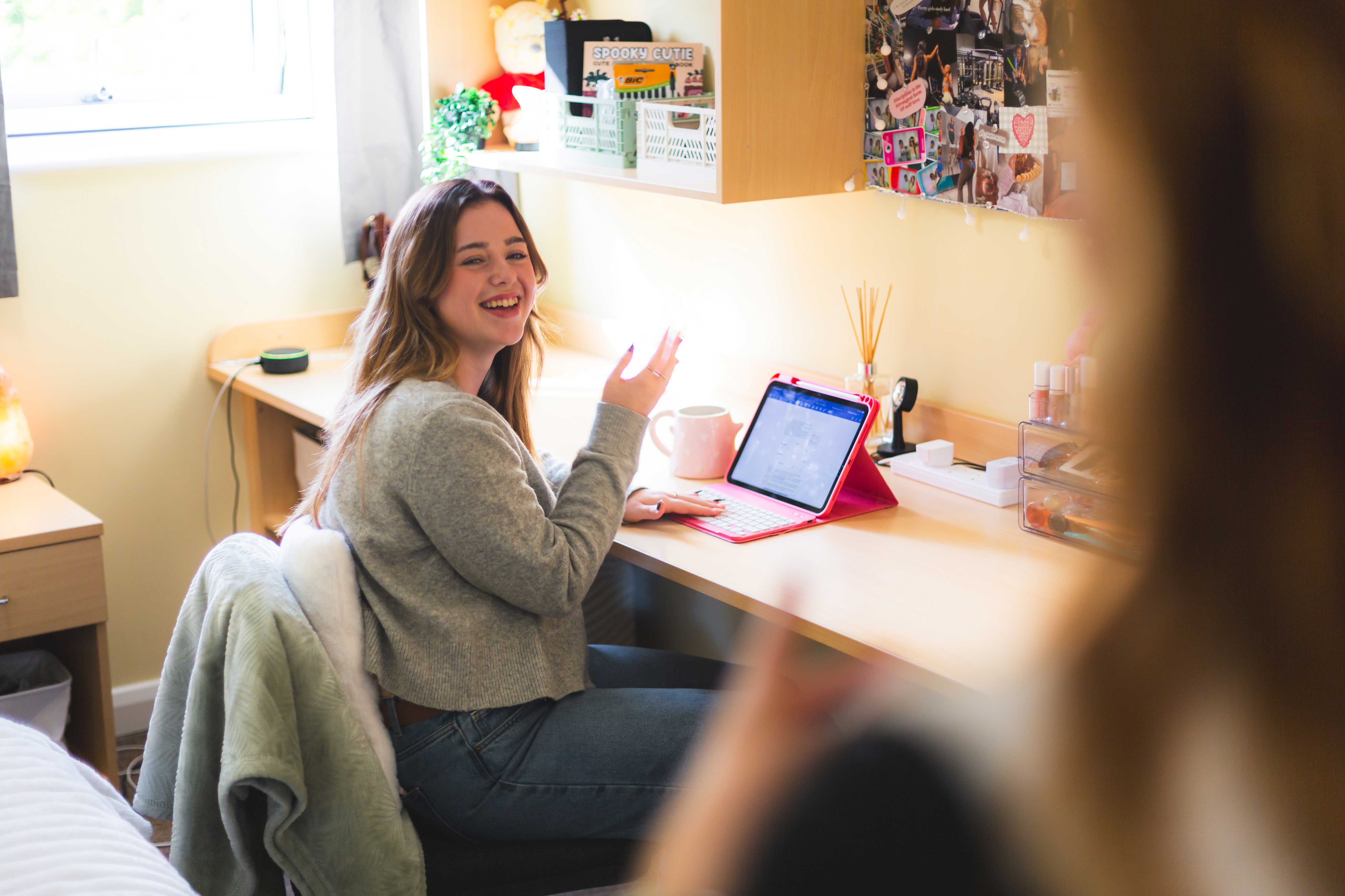 A student studying in her halls of residence