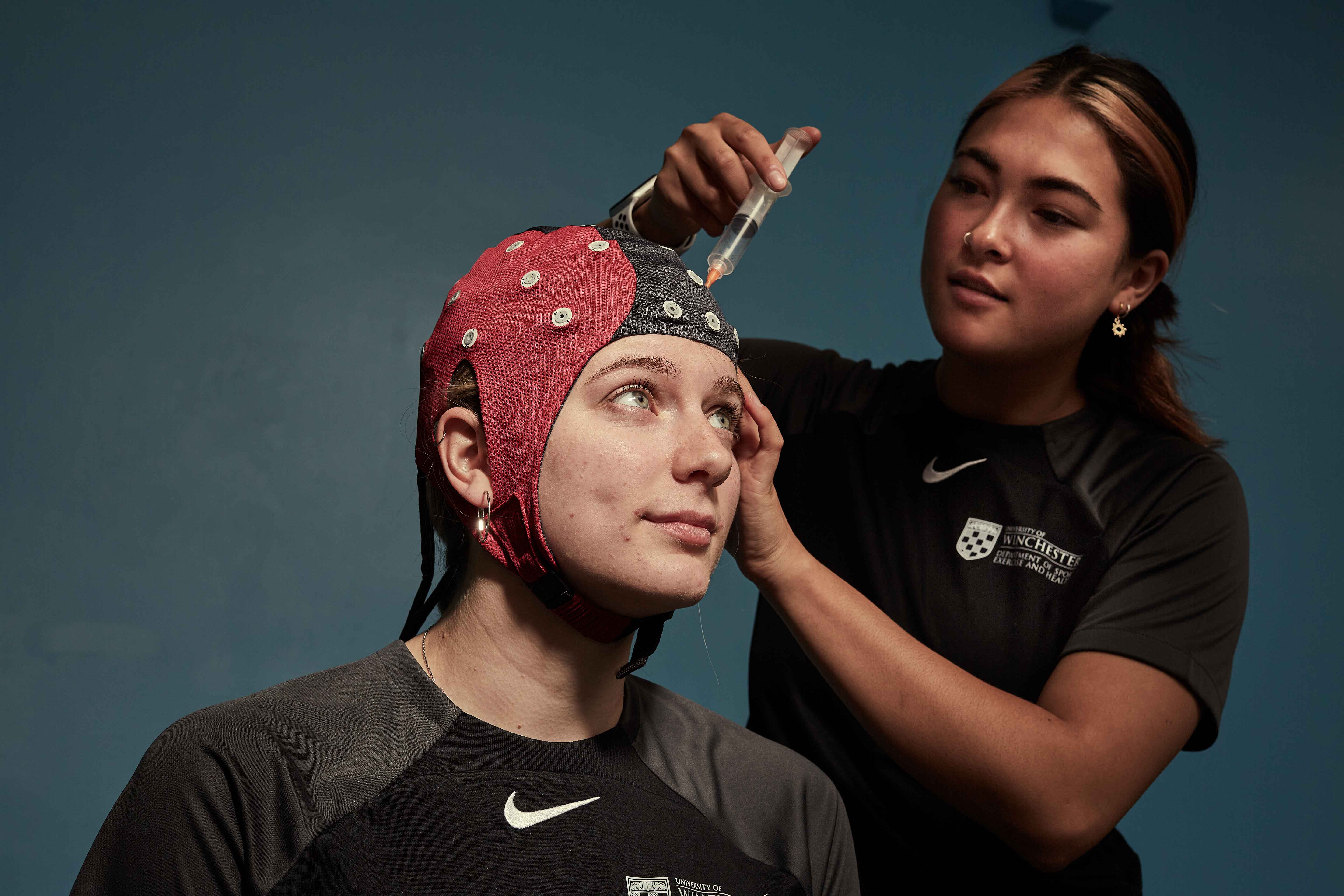 Students using psychology testing equipmnent