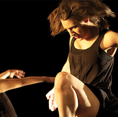 Dancers performing in a studio