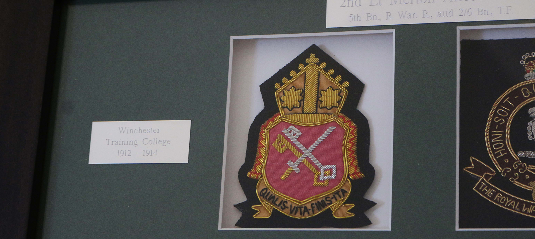 Badge from King Alfreds College in a frame