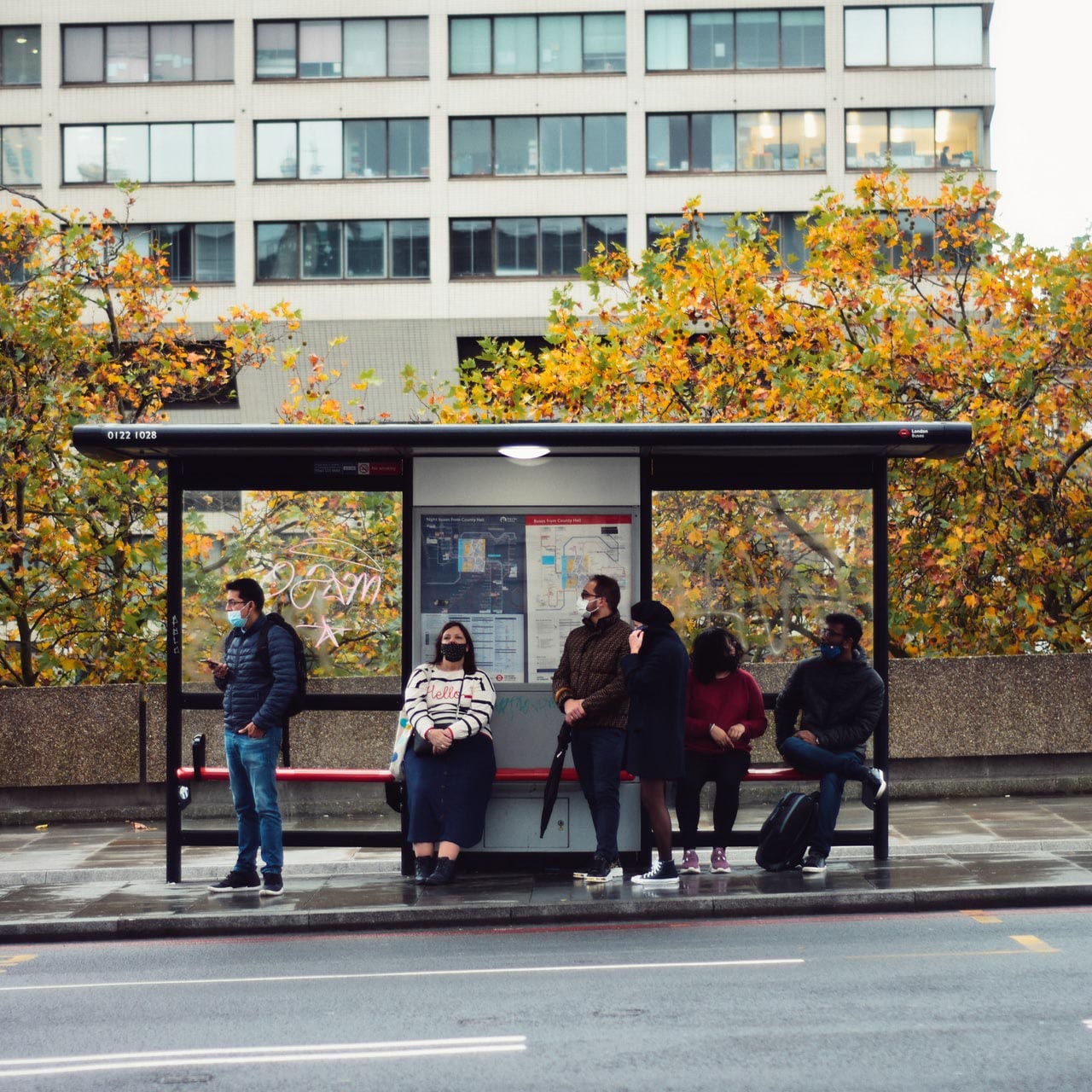 People waiting at a bus stop