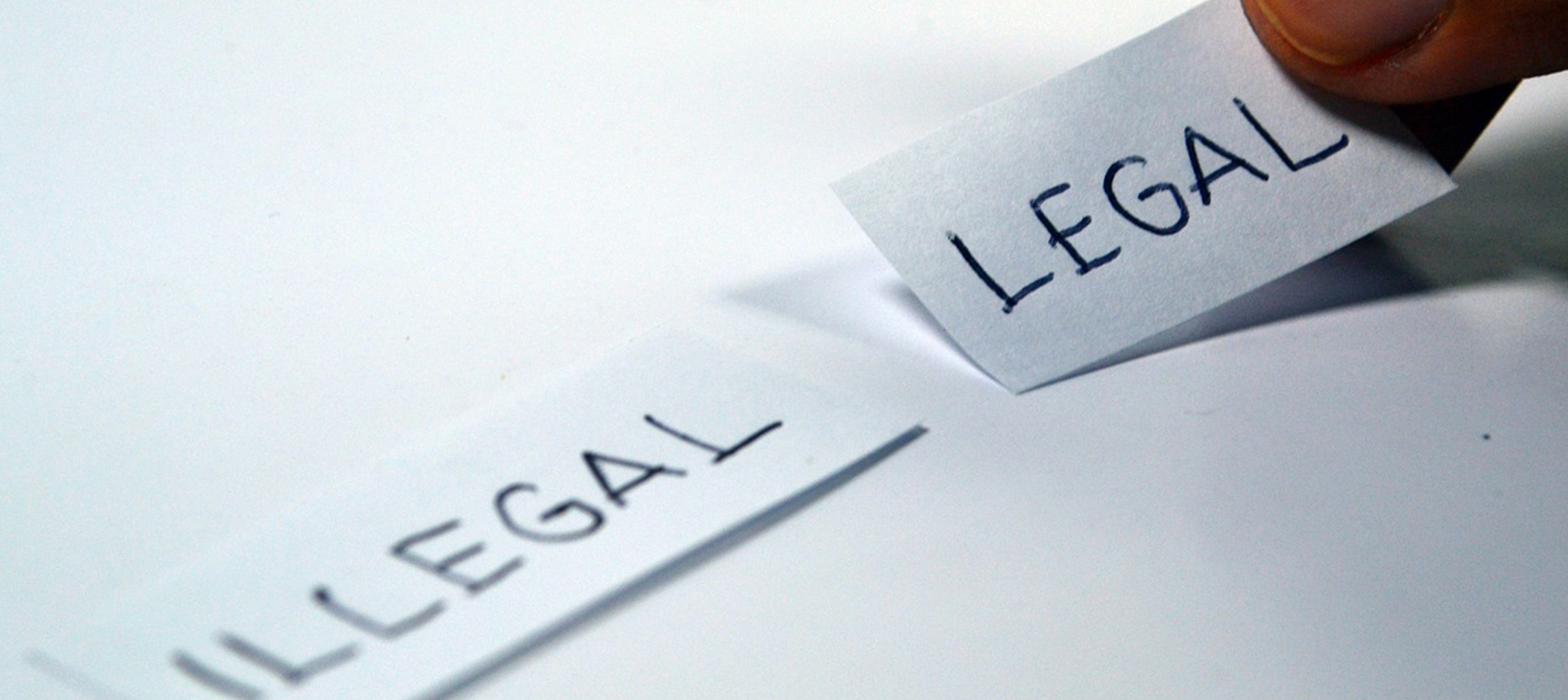 The word legal written by hand on a piece of paper