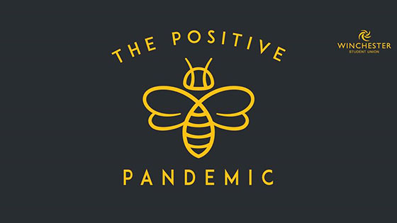 Positive pandemic logo with gold text and bee on black background