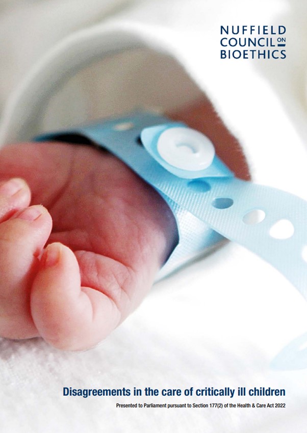 Baby's hand with hospital tag