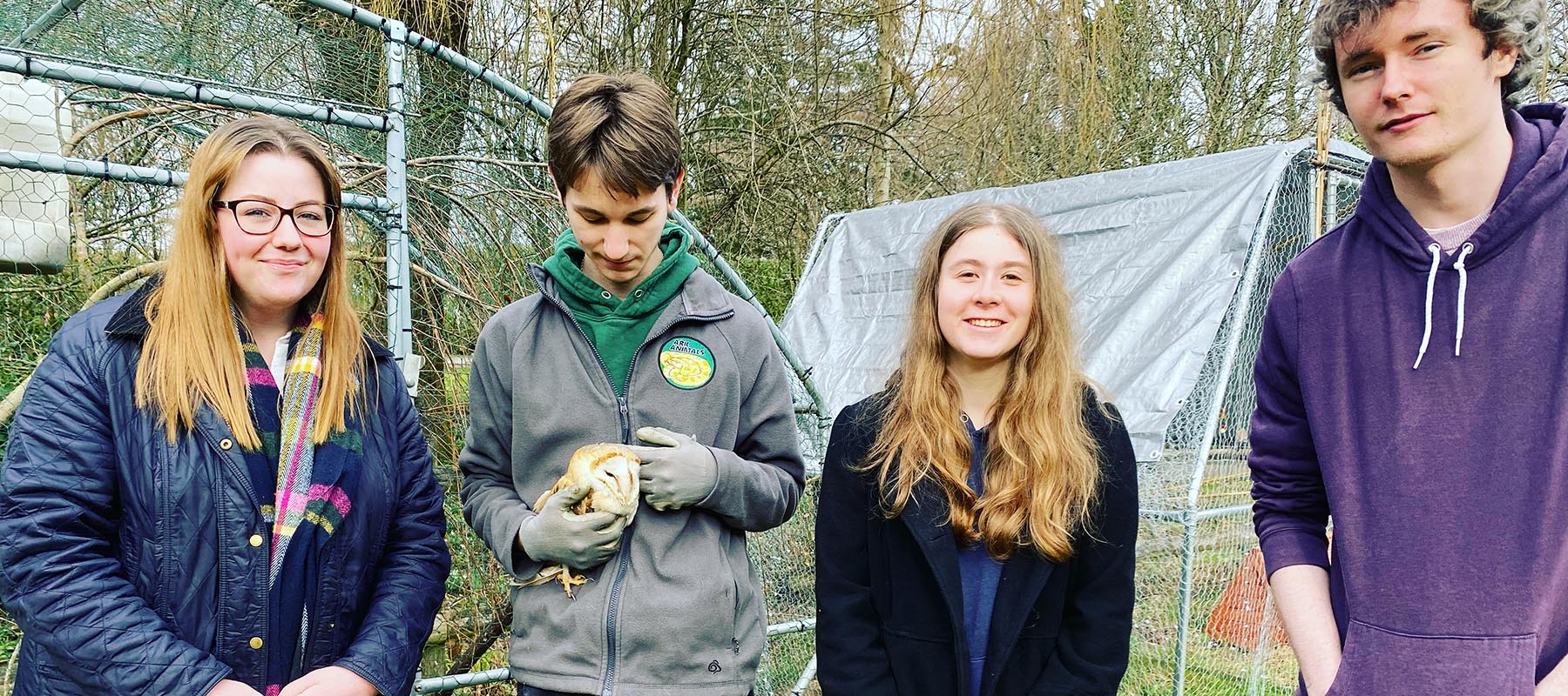Student volunteers and owl at the Ark Centre