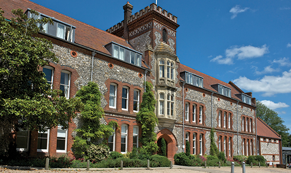 Red brick and flint exterior facade of the University of Winchester Business School