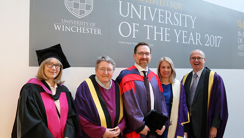 Alec Charles with Vice Chancellor Joy Carter and fellow members of faculty