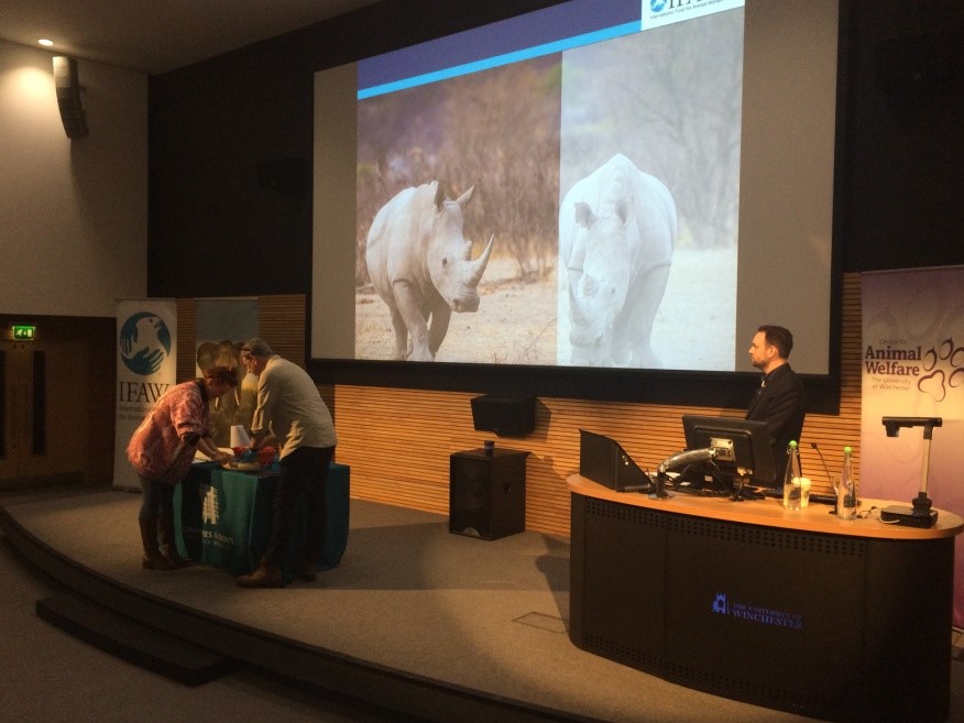 International Fund for Animal Welfare lecture, with rhinos displayed on the projector