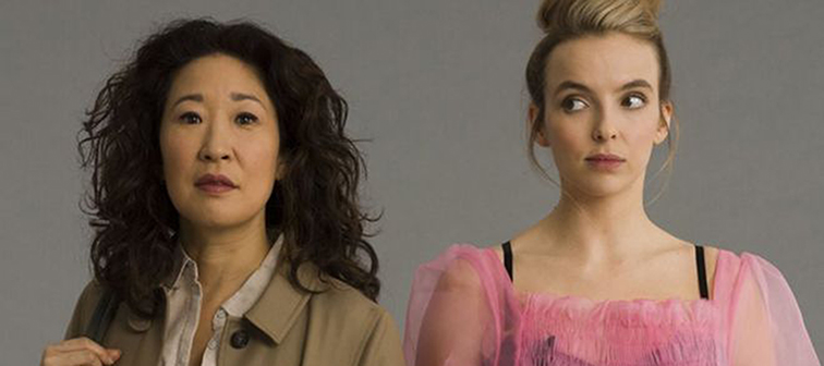 Eve and Villanelle, the characters from Killing Eve standing shoulder to shoulder