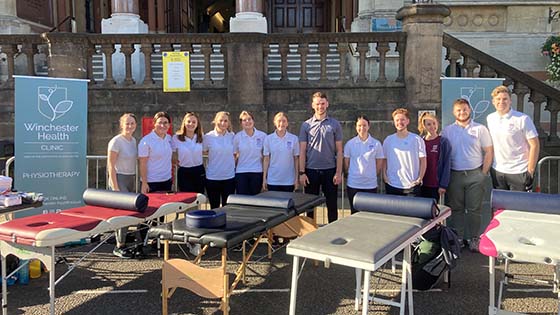 Liam newton with student physiotherapists outside the Guildhall at the Winchester Marafun