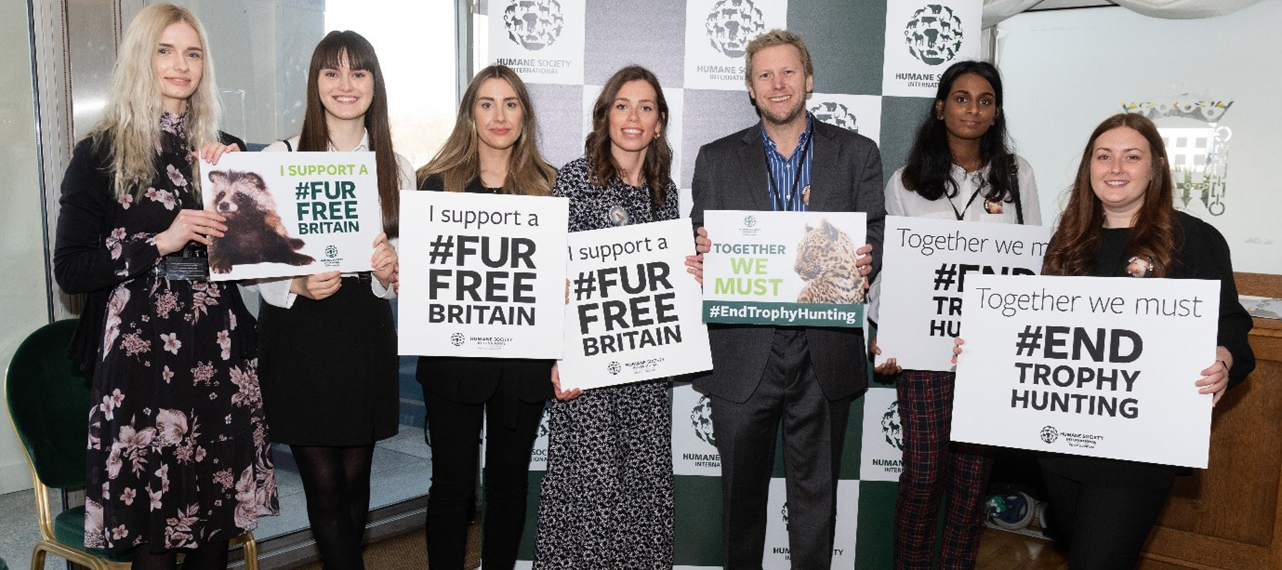 students holding Fur Free Britain placards